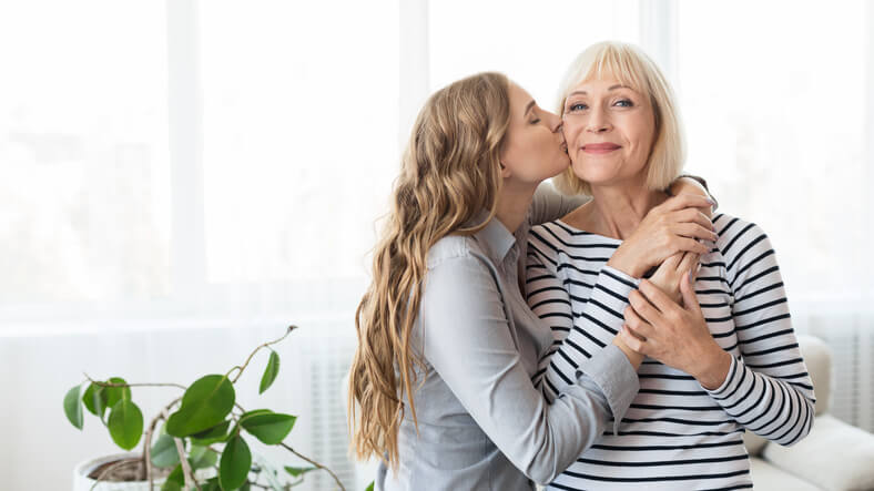 two women hug