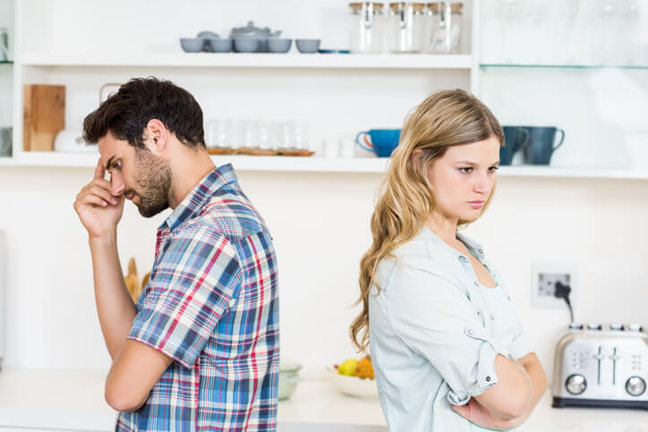 man and woman arguing in kitchen