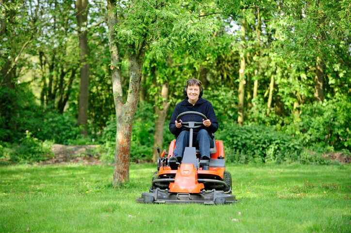 Person riding a lawn mower