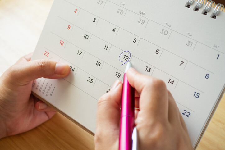 woman marking calendar