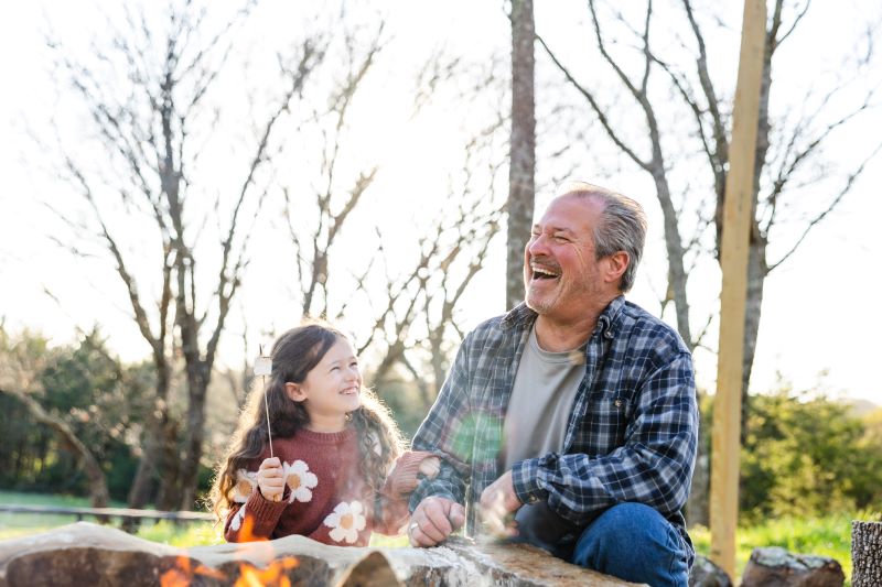 granddaughter and grandfather laughing