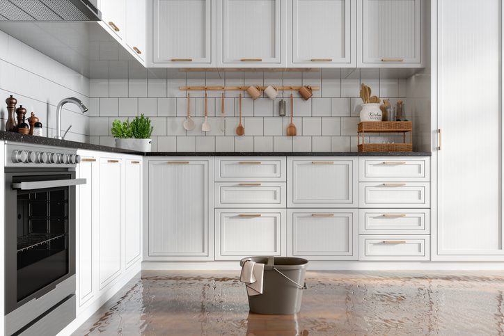 A kitchen flooded with standing water