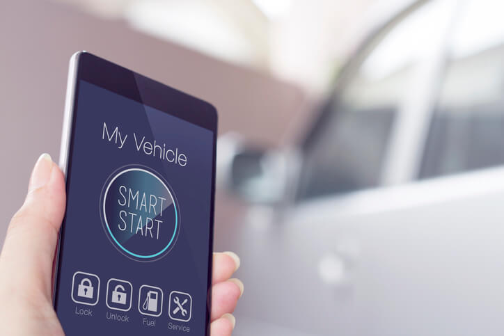 Person starting a car with their phone app