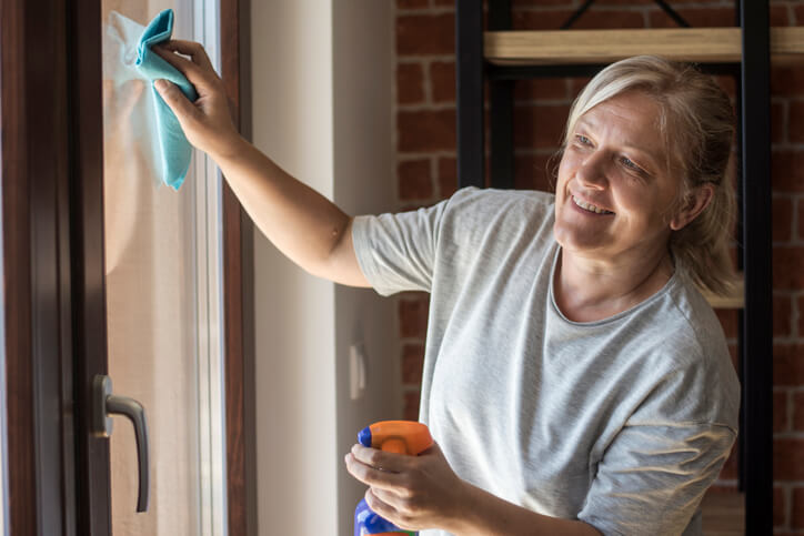 woman cleans window