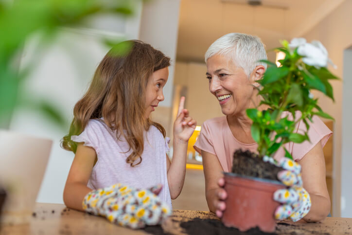 Family members repotting plants together