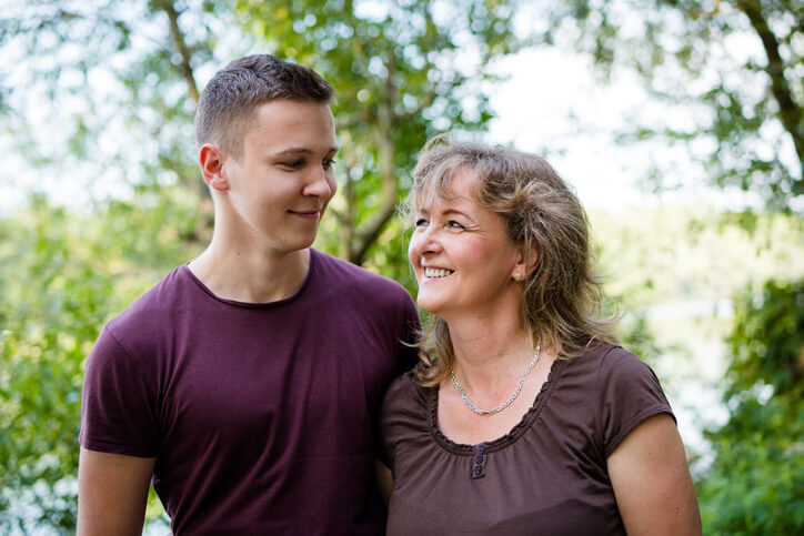 adult man and mother in forest