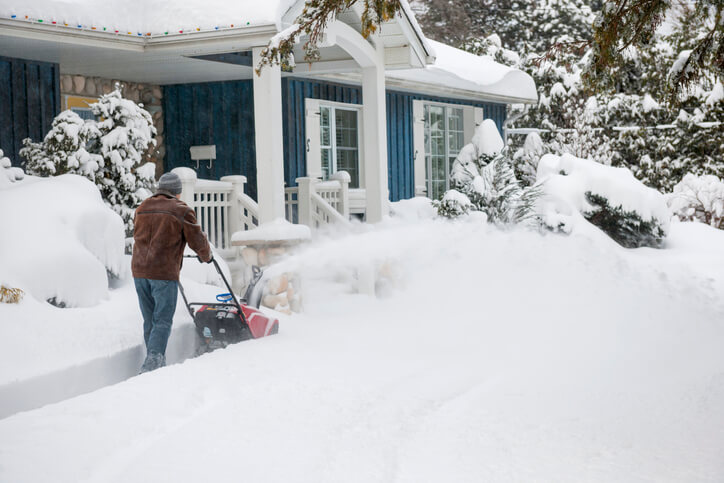 Person snowblowing at their home