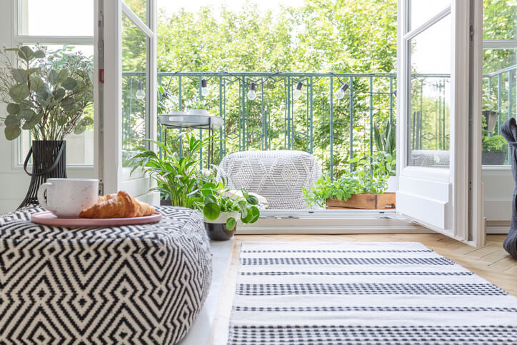 A rug leading to the open doors of a porch