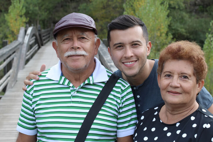 parents and son on bridge