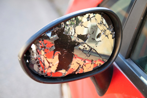A shattered car side view mirror