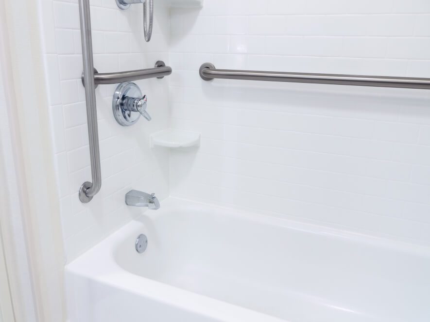 Bathroom with grab bars in the shower