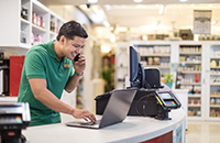 small business owner feeling relieved after learning about business insurance FAQs