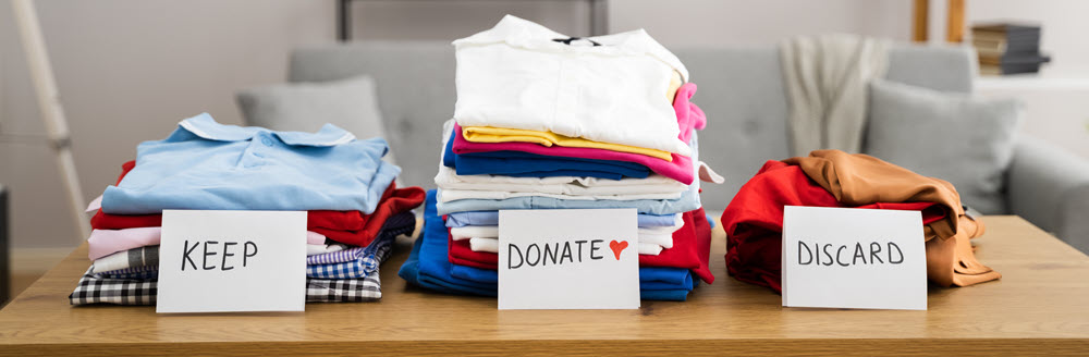 labeled piles of clothes
