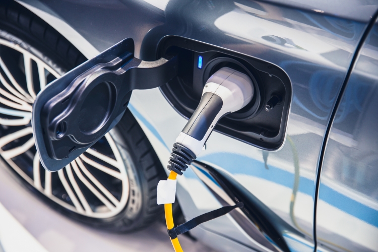 An electric car plugged in to charge