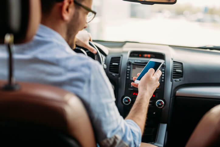 a driver checking their phone
