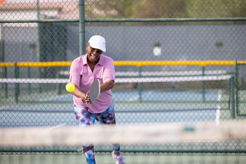 woman plays pickleball