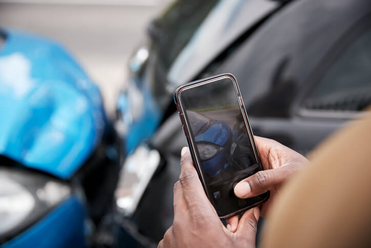 Taking a photo of a car accident