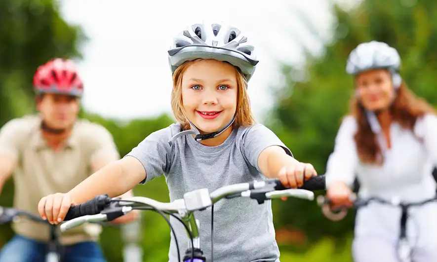 A family riding bikes