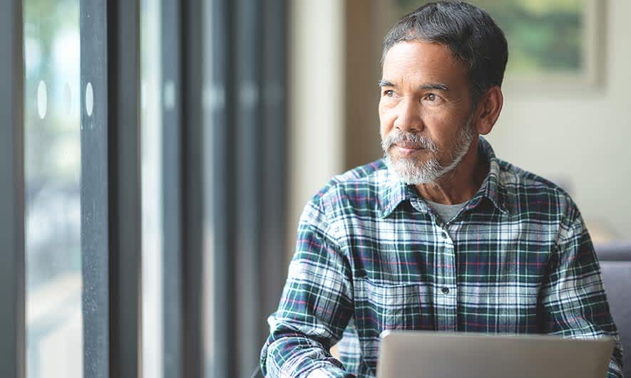 small business owner looks up How To Get Workers’ Comp Insurance claim