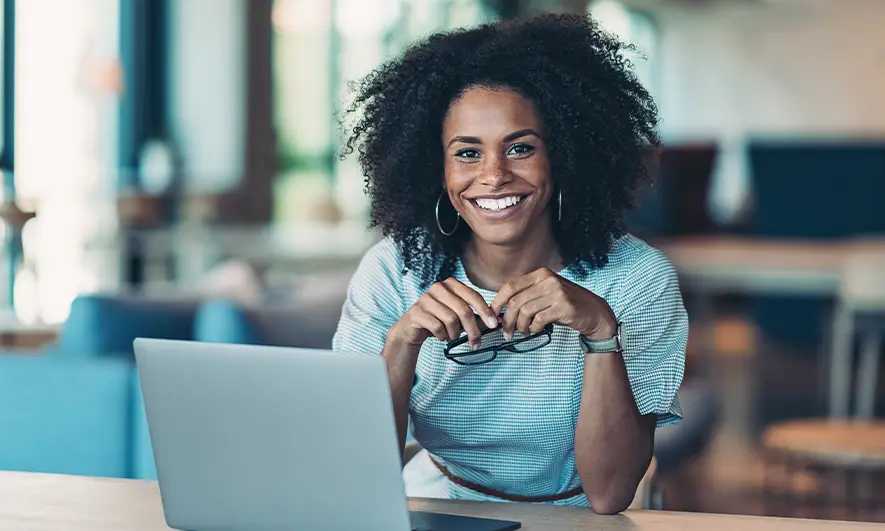 Woman with a laptop smiling