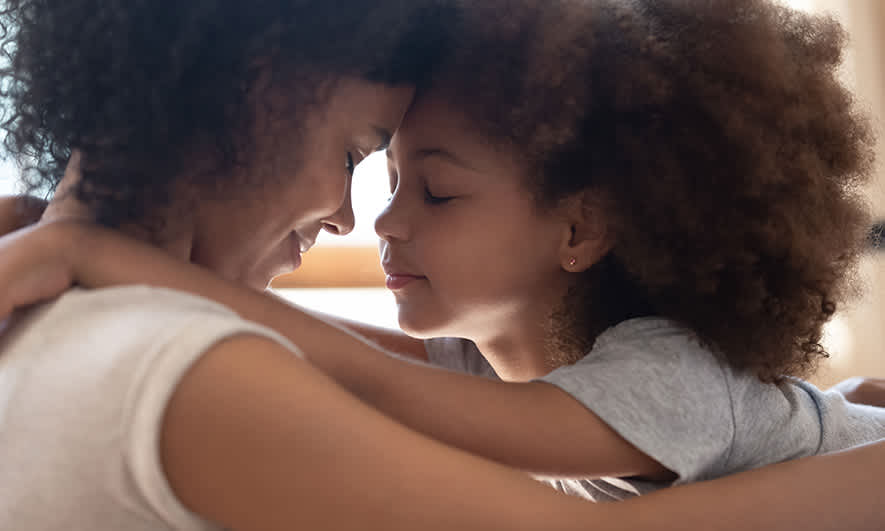 A mom and child embrace