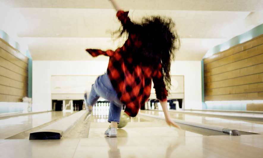 Woman slips and falls while bowling