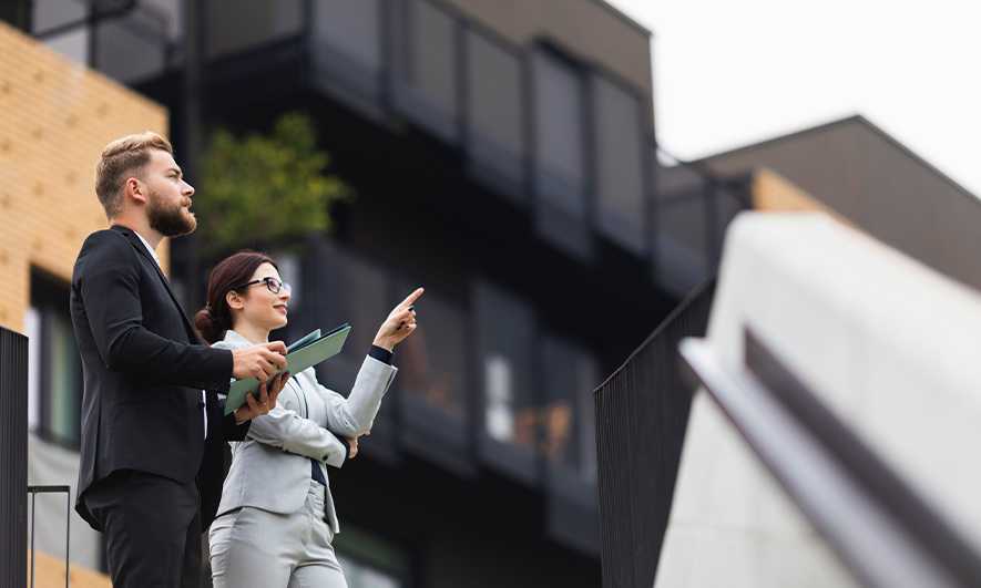 Property evaluators outside a building