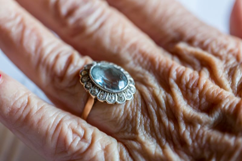 A vintage ring on the hand of an old woman