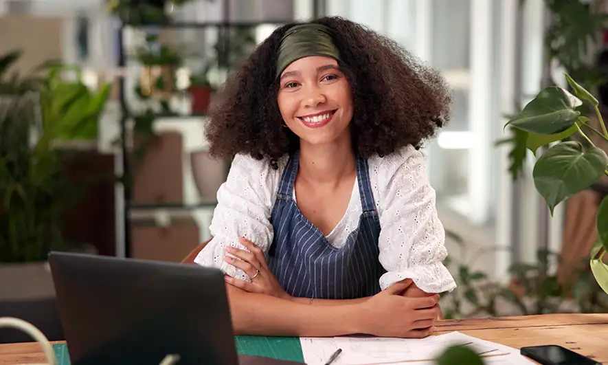 A business owner sitting at their desk