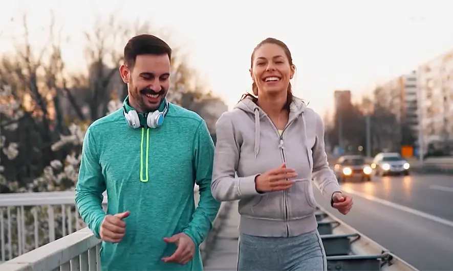 Two people running recreationally