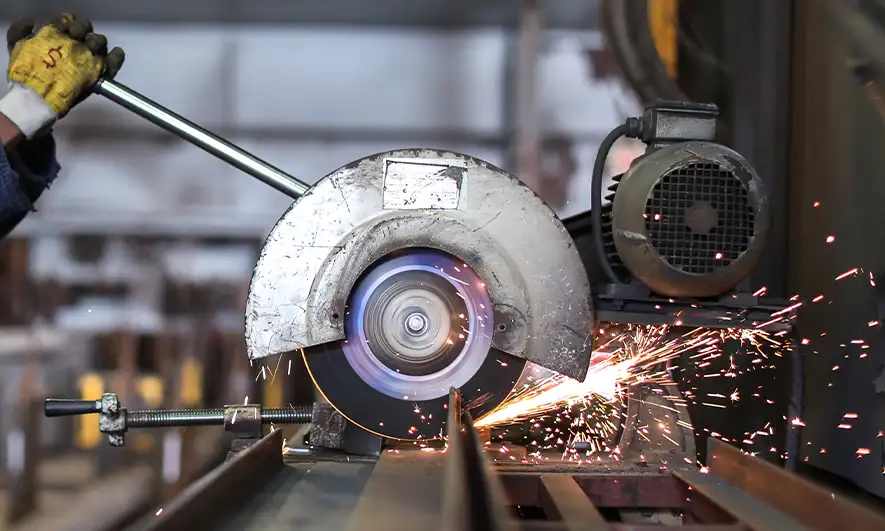 Saw cutting into metal with sparks coming out