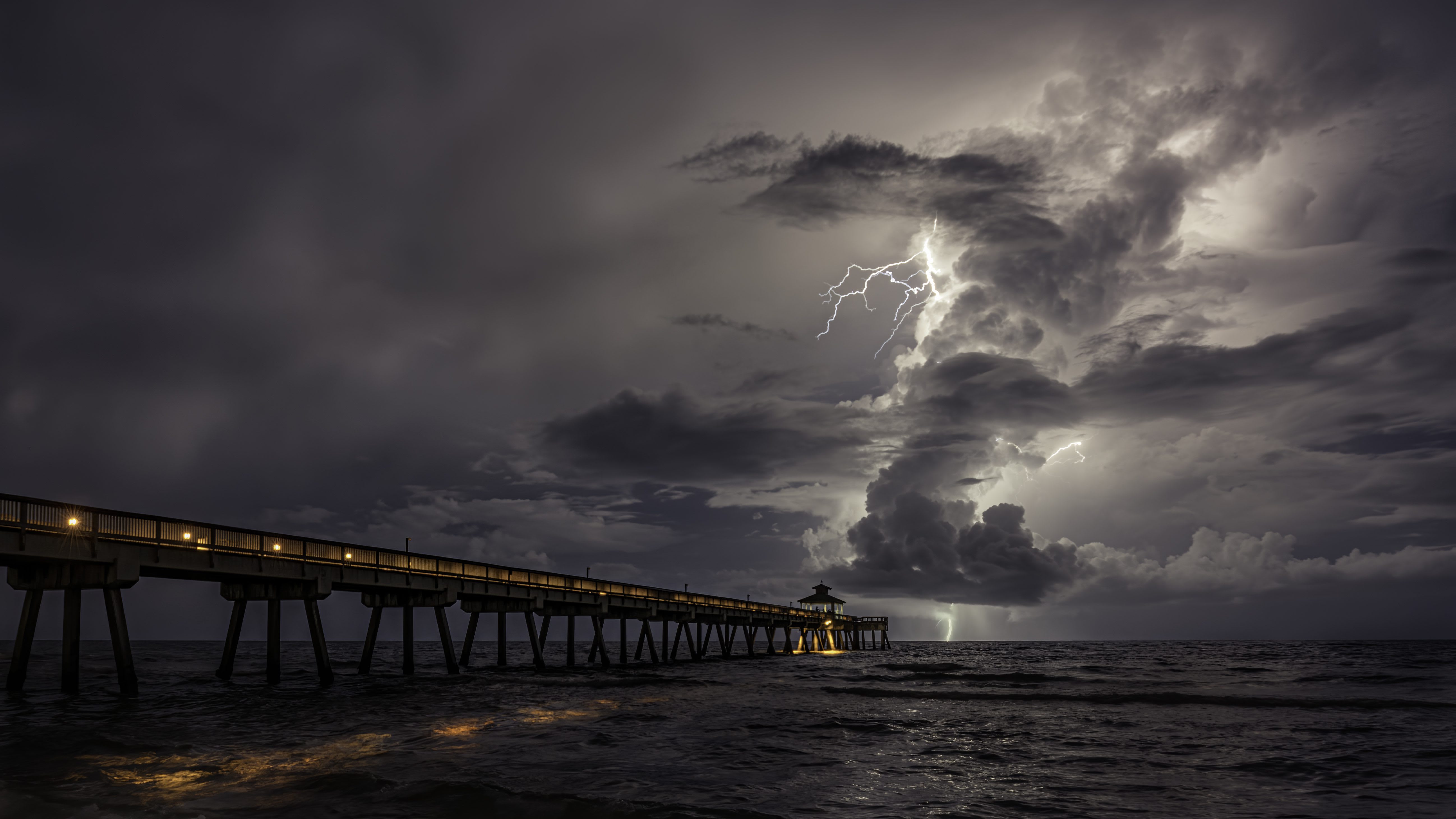 Lightning over an ocean boardwalk