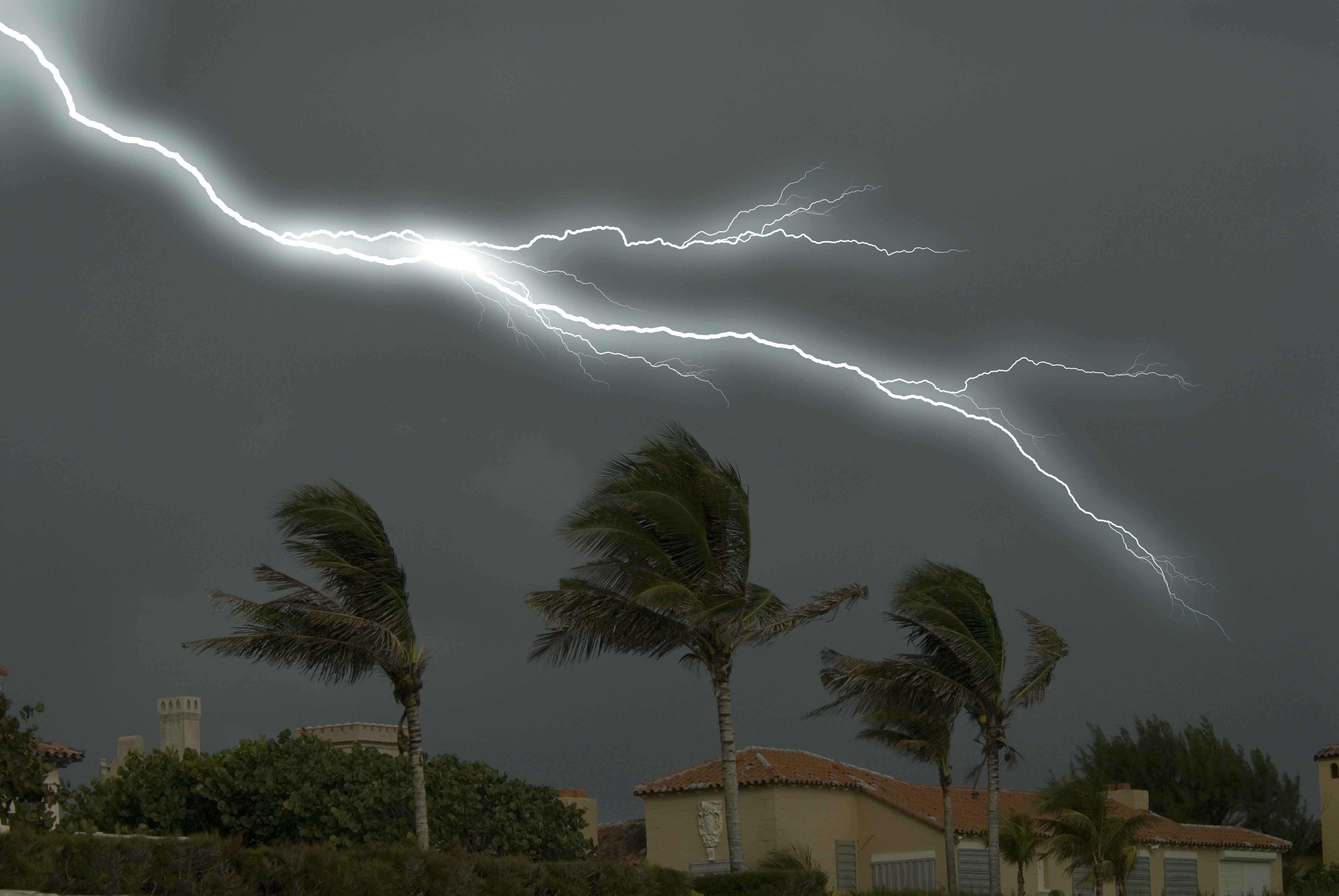 Lightning behind beach houses