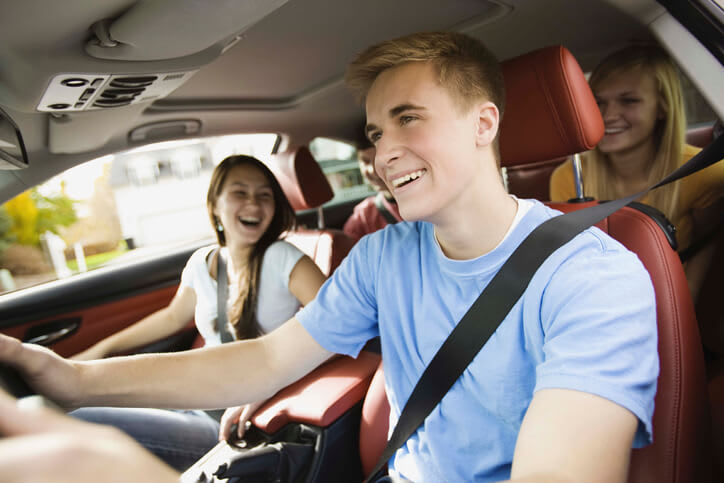 a group of teens in a car