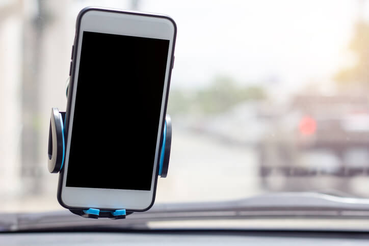 Cell phone mounted to a windshield