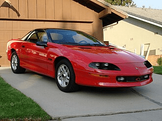 red car in a driveway
