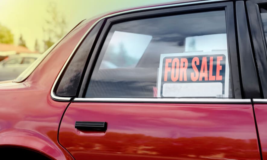For Sale sign in a car window