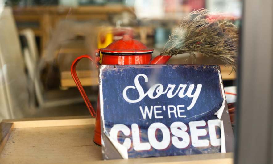 Sign in a store window reads 