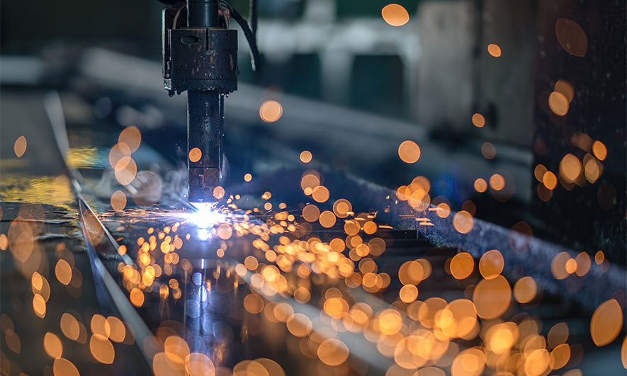 Sparks fly from a large machine