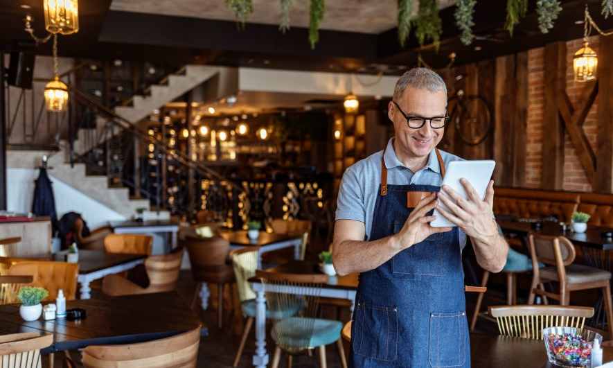 restaurant owner reviewing costs