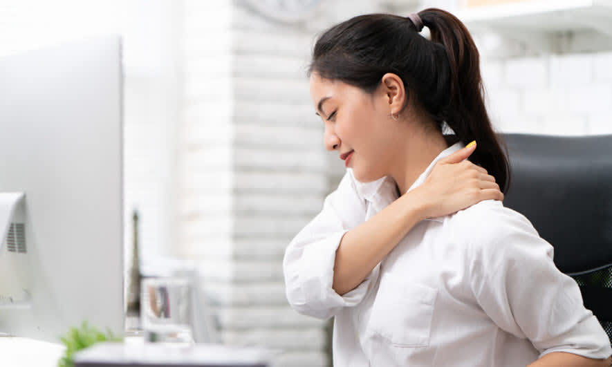 A desk worker massaging their neck