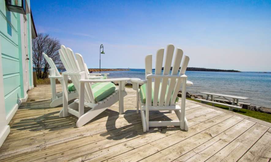 Adirondack chairs on a beachside patio