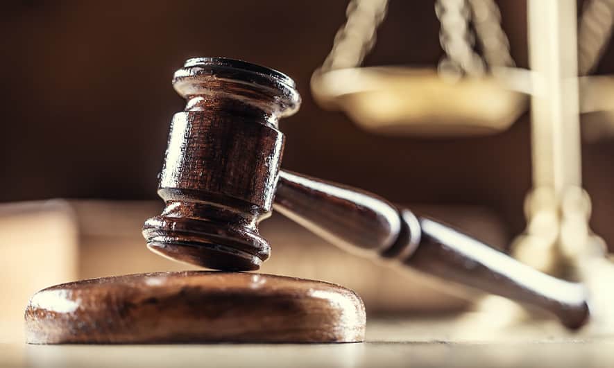 court gavel hitting wood.