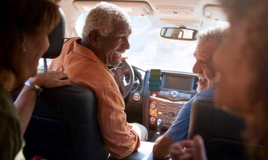A group of middle-aged friends in a car together