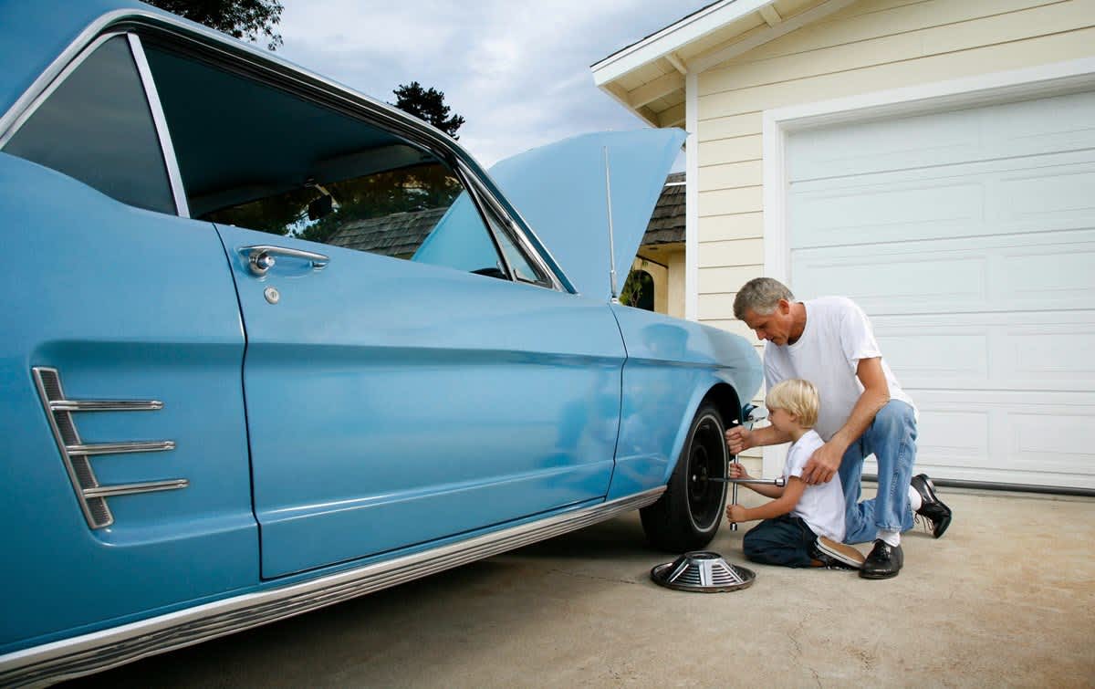grandfather enjoys being covered by classic car insurance