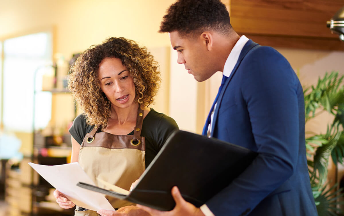 accountant talking to client about professional liability insurance
