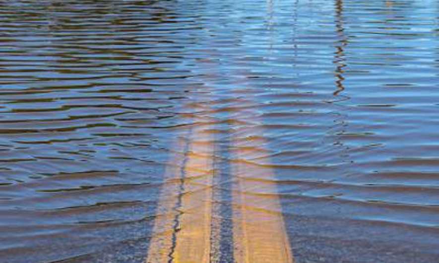 A flooded asphalt road