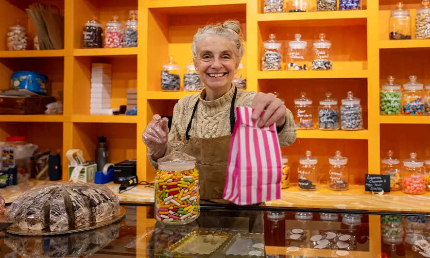 female business owner protected by candy insurance