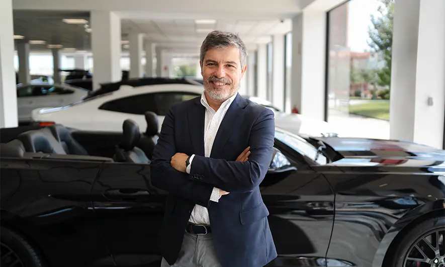 business owner protected by car dealer insurance