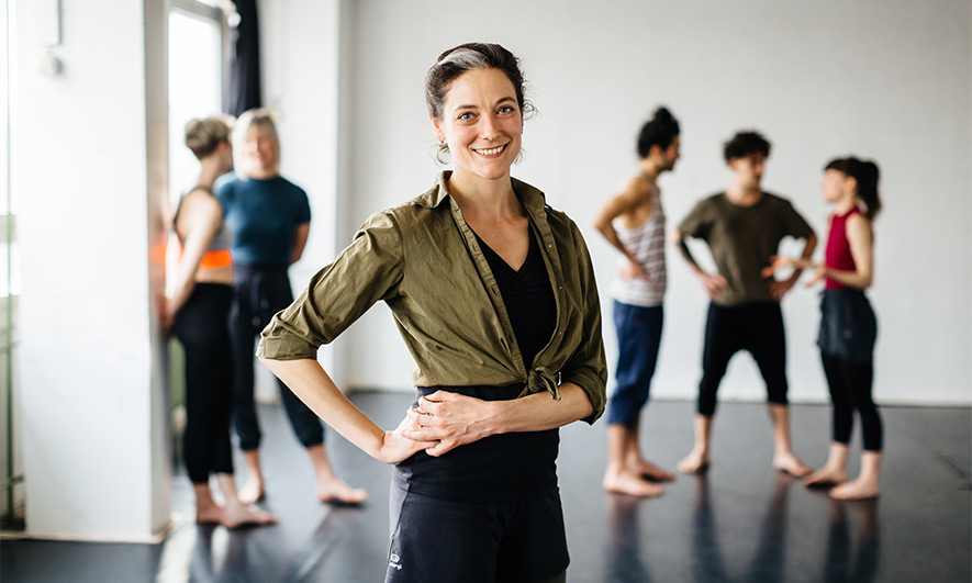 small business owner feeling happy with their dance instructor insurance